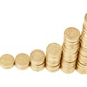 Image of coins staked up for the header of the blog get a quote for LCL shipping