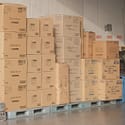 Pallets of goods in a storage warehouse for In this blog, we’ll help clarify things by explaining what LCL shipping is and taking a closer look at the advantages of LCL shipping for small businesses