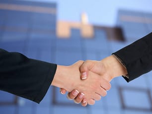 image of two hands locked in a handshake