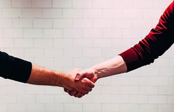 image of handshake for competitive shipping quotes blog