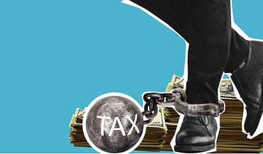 an image of a ball and chain round an ankle to represent tax