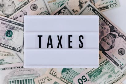Image of money and taxes sign for blog How To Pay Import Tax On Imported Goods In 2024 